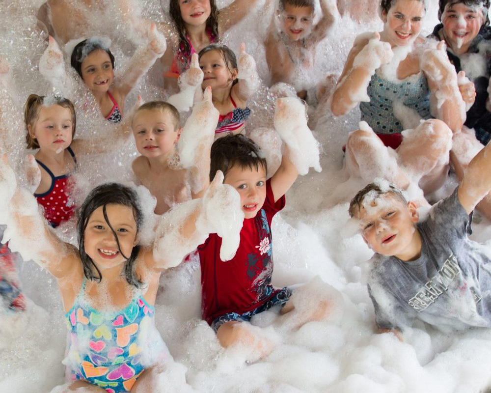 Children playing in bubbles